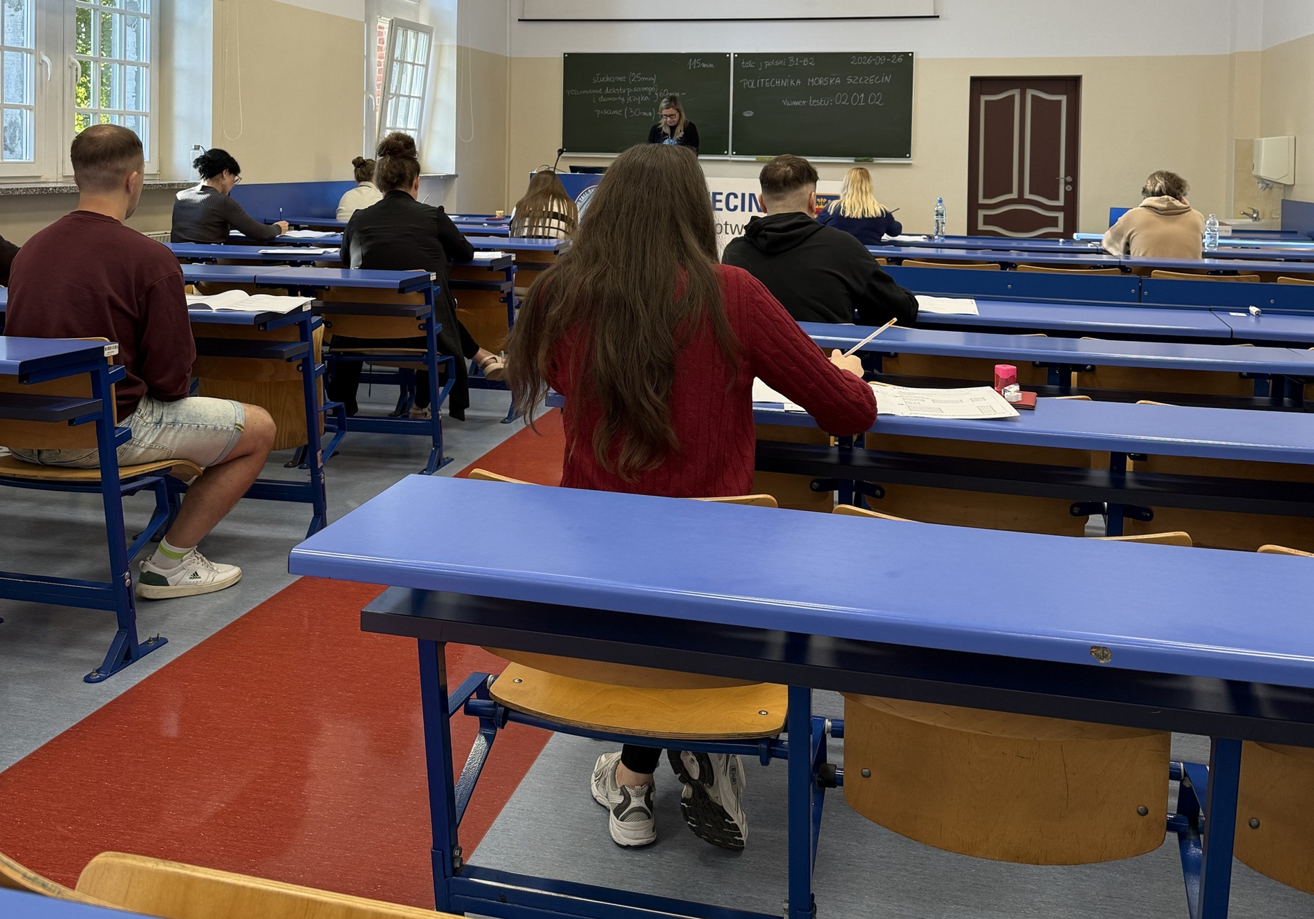 Uczestnicy egzaminu telc z języka polskiego na sali egzaminacyjnej